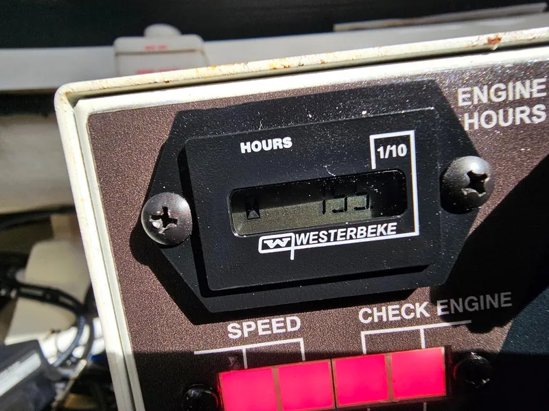 Slide: The Image of Westerbeke engine hour meter on 2023 Formula 350 Crossover Bowrider dashboard. - 46