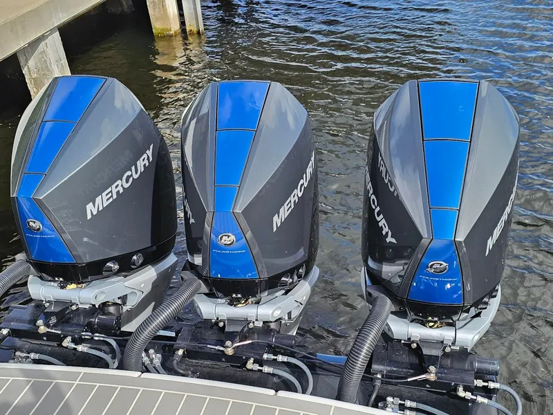 Slide: The Image of Three Mercury outboard engines on a 2023 Formula 350 Crossover Bowrider. - 8
