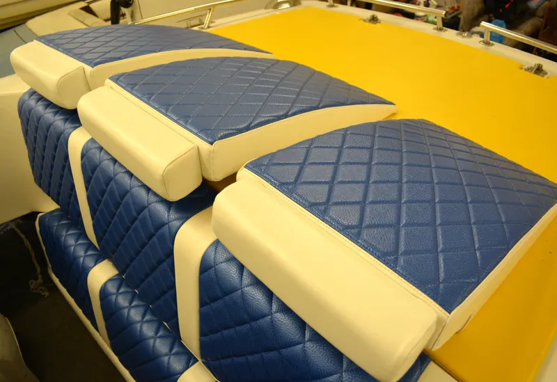Slide: The Image of Blue and yellow quilted seats on 1980 Sutphen 30 Oceanpacer boat. - 16