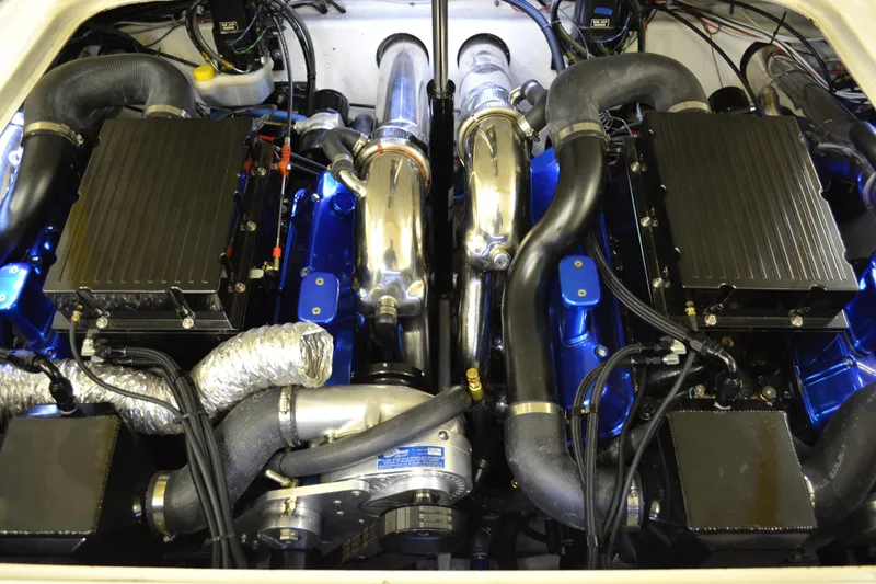 Slide: The Image of 1980 Sutphen 30 Oceanpacer engine compartment with dual engines and chrome components. - 19