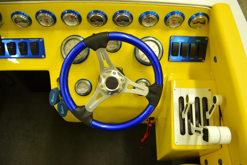 Slide: The Image of 1980 Sutphen 30 Oceanpacer dashboard with blue steering wheel and gauges. - 6