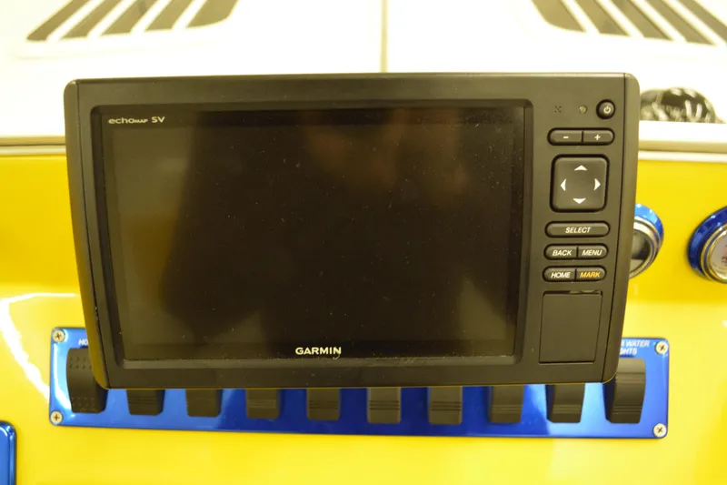 Slide: The Image of Garmin Echomap 5V on 1980 Sutphen 30 Oceanpacer dashboard, yellow background. - 8