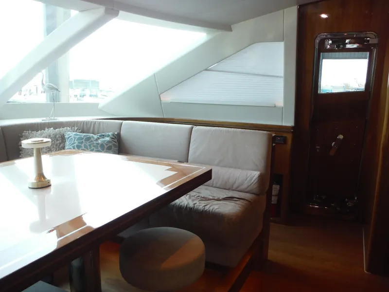 Slide: The Image of Luxurious interior of 2015 Horizon E88 yacht with modern seating and dining area. - 28