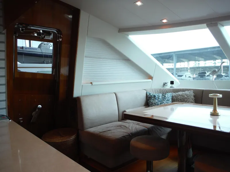 Slide: The Image of Luxurious interior of 2015 Horizon E88 yacht with plush seating and elegant dining area. - 29