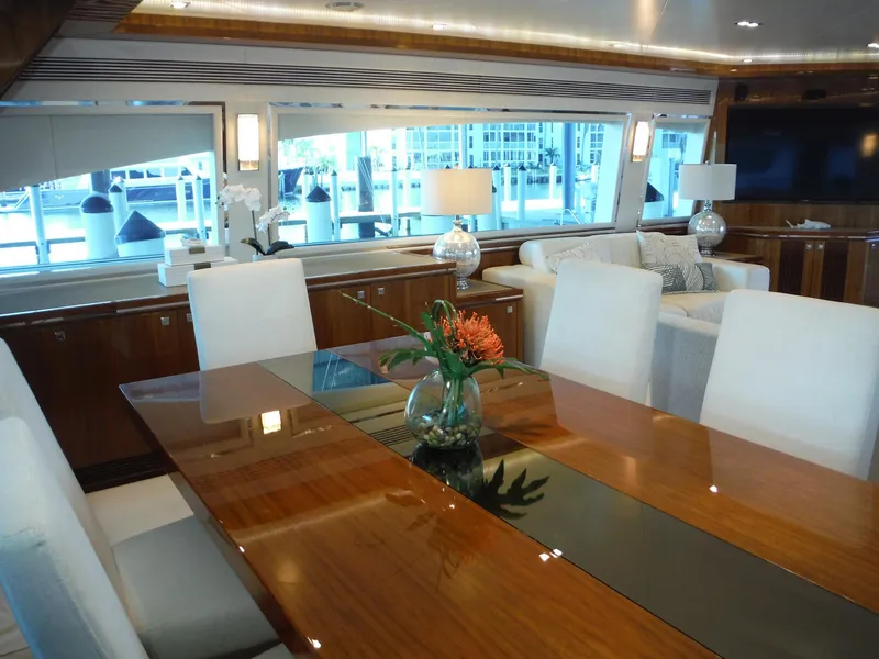 Slide: The Image of Luxurious interior of 2015 Horizon E88 yacht with elegant dining area and large windows. - 32