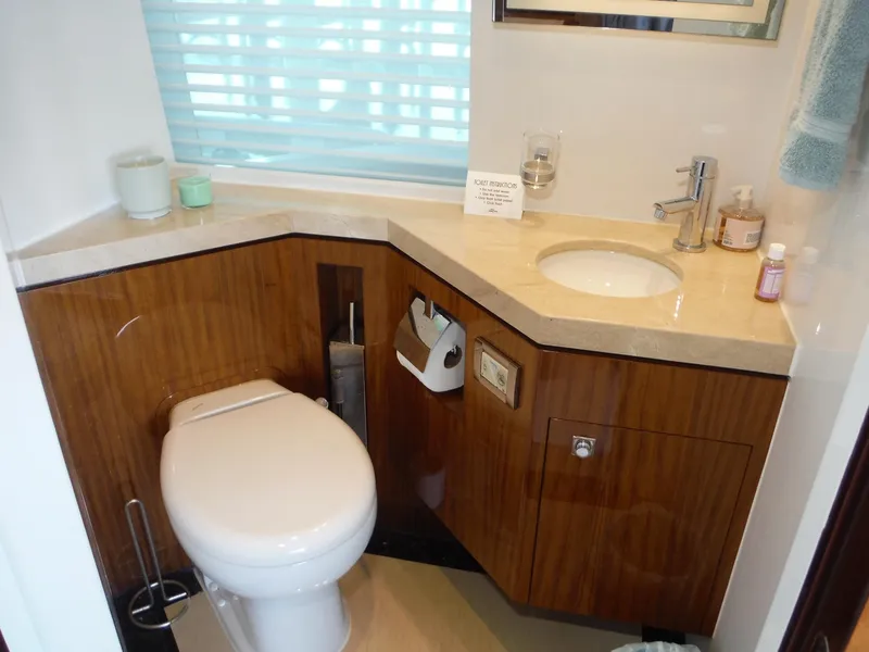 Slide: The Image of Luxurious bathroom in 2015 Horizon E88 yacht with modern fixtures and wooden cabinetry. - 35