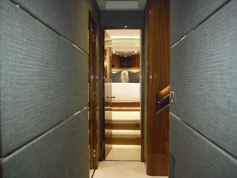Slide: The Image of Luxurious hallway inside 2015 Horizon E88 yacht, featuring elegant wood paneling. - 48