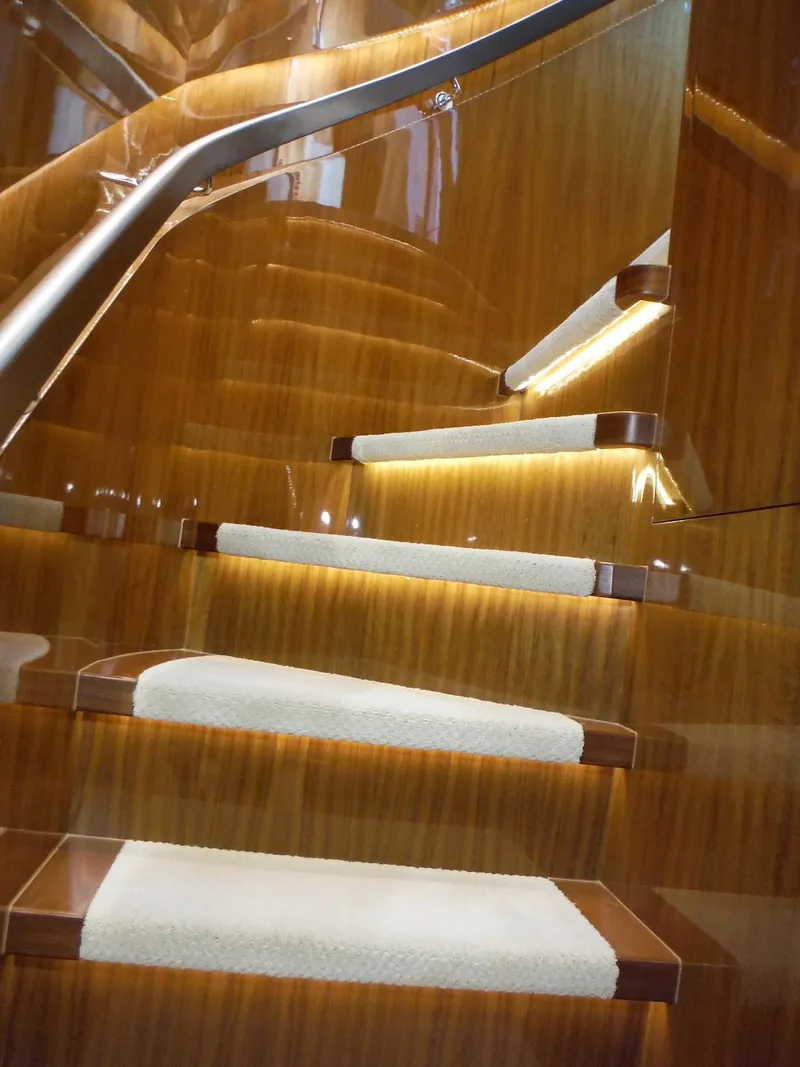 Slide: The Image of Luxurious wooden staircase with soft lighting on a 2015 Horizon E88 yacht. - 49