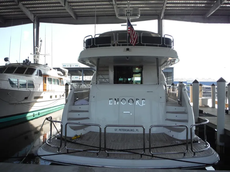 Slide: The Image of Luxury yacht Horizon E88, 2015 model, docked in a marina. - 8