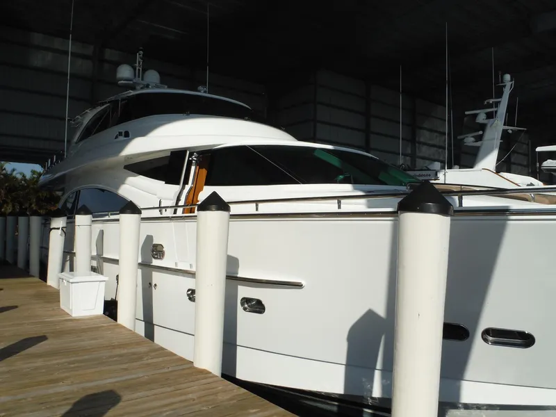 Slide: The Image of Luxury 2015 Horizon E88 yacht docked in marina. - 9