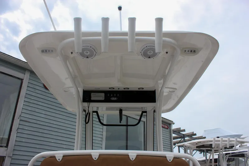 Slide: The Image of 2021 Sea Hunt Ultra 265 SE boat with T-top and rod holders. - 11