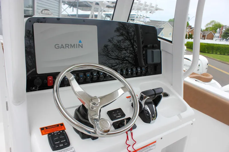 Slide: The Image of 2021 Sea Hunt Ultra 265 SE boat dashboard with Garmin navigation system. - 15