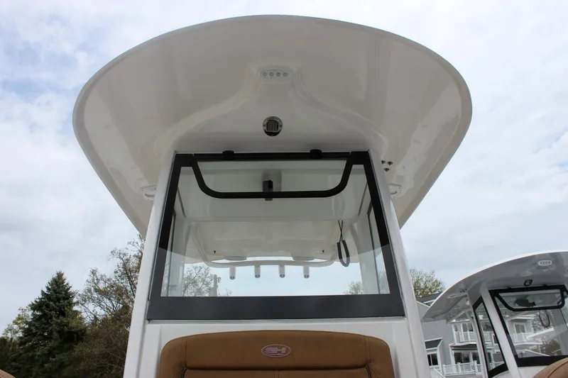 Slide: The Image of 2021 Sea Hunt Ultra 265 SE boat console with T-top and seating, viewed from below. - 19