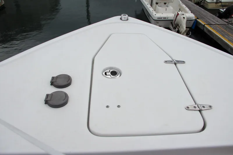 Slide: The Image of Bow of 2021 Sea Hunt Ultra 265 SE boat at dock. - 22