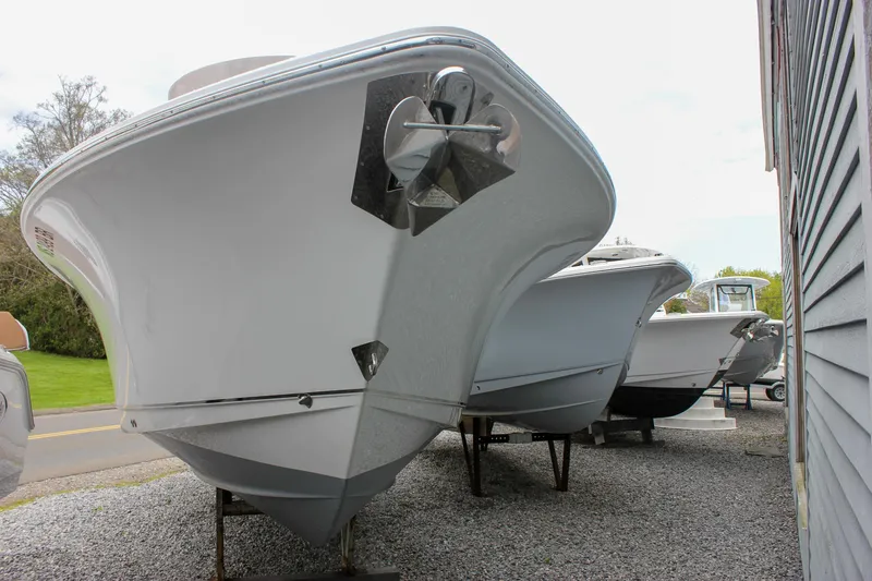 Slide: The Image of 2021 Sea Hunt Ultra 265 SE boats displayed outdoors on gravel. - 36