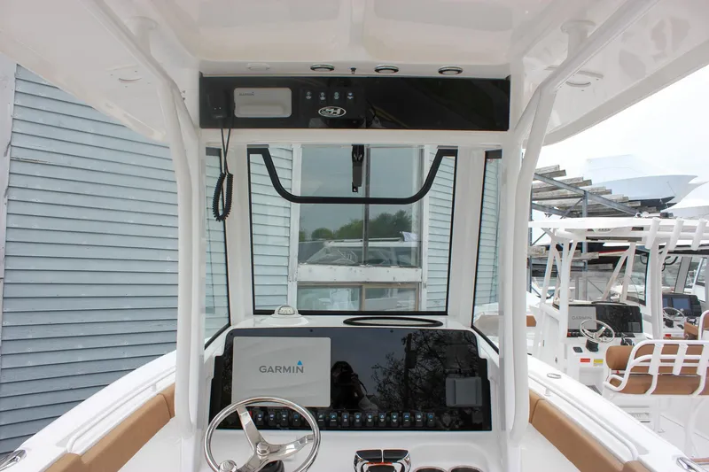 Slide: The Image of 2021 Sea Hunt Ultra 265 SE boat dashboard with Garmin navigation system. - 9