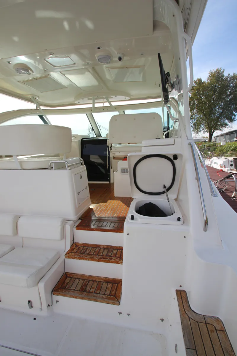 Slide: The Image of 2007 Tiara Yachts 4200 Open interior with wooden steps and seating area. - 30
