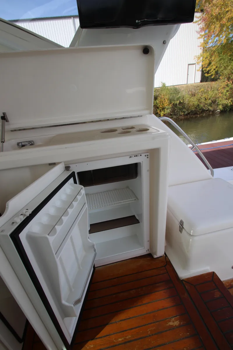 Slide: The Image of 2007 Tiara Yachts 4200 Open with open fridge on teak deck. - 31