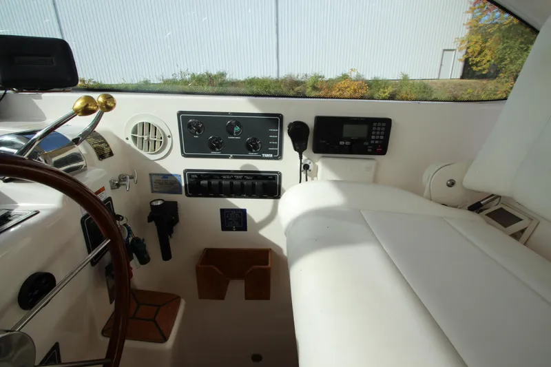 Slide: The Image of 2007 Tiara Yachts 4200 Open helm with control panel and steering wheel. - 36