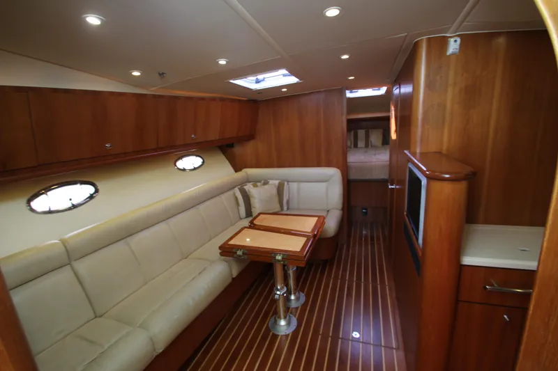 Slide: The Image of 2007 Tiara Yachts 4200 Open interior with elegant wood finish and comfortable seating. - 40