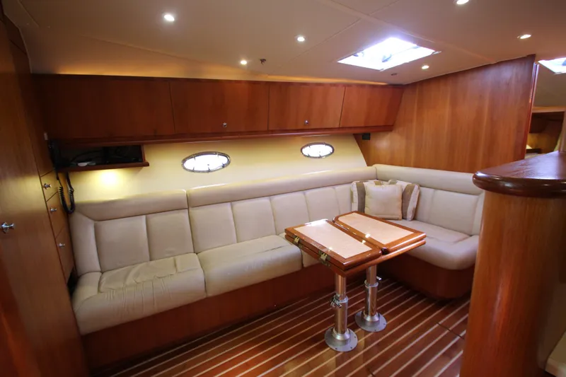 Slide: The Image of Luxurious interior of 2007 Tiara Yachts 4200 Open with elegant seating and wooden accents. - 41