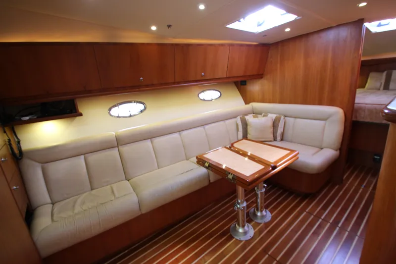 Slide: The Image of Luxurious interior of 2007 Tiara Yachts 4200 Open with plush seating and wooden accents. - 42