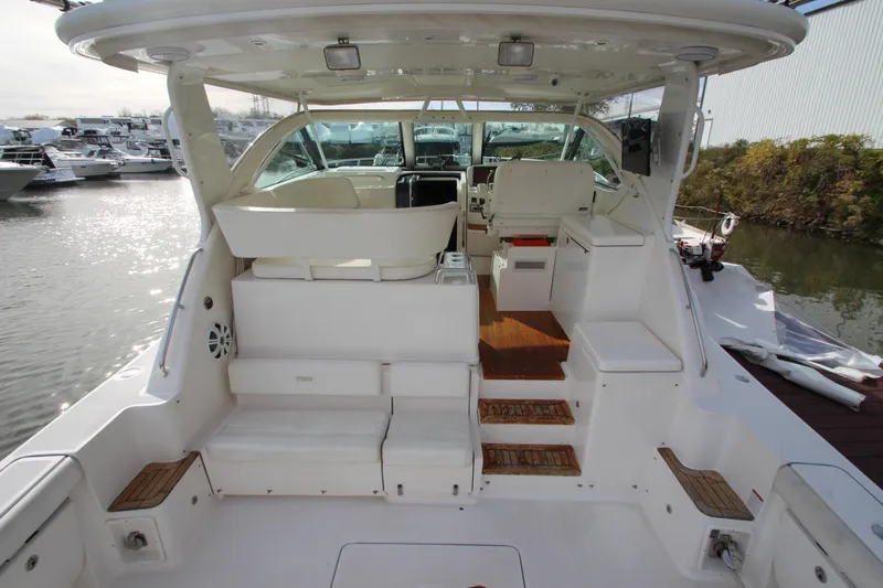 Slide: The Image of 2007 Tiara Yachts 4200 Open, spacious deck, luxurious seating, docked at marina. - 7
