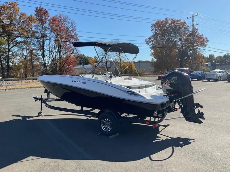 The Image of 2025 Tahoe T18 boat on trailer in sunny parking lot. - 0