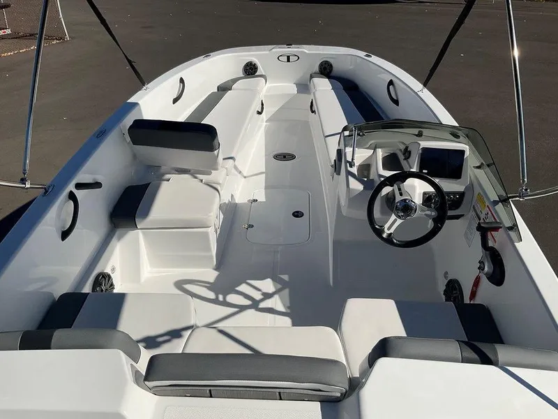 Slide: The Image of 2025 Tahoe T18 boat interior with seating and steering wheel. - 11
