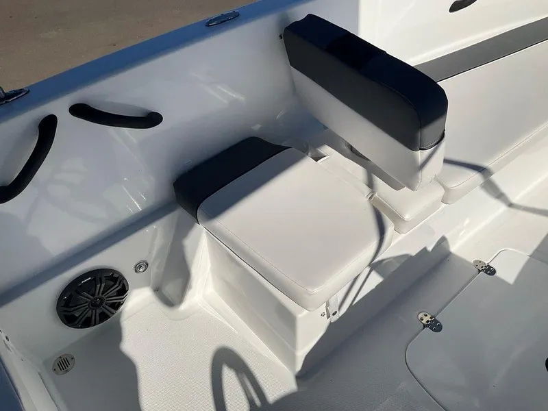 Slide: The Image of 2025 Tahoe T18 boat interior with cushioned seating and speaker. - 15