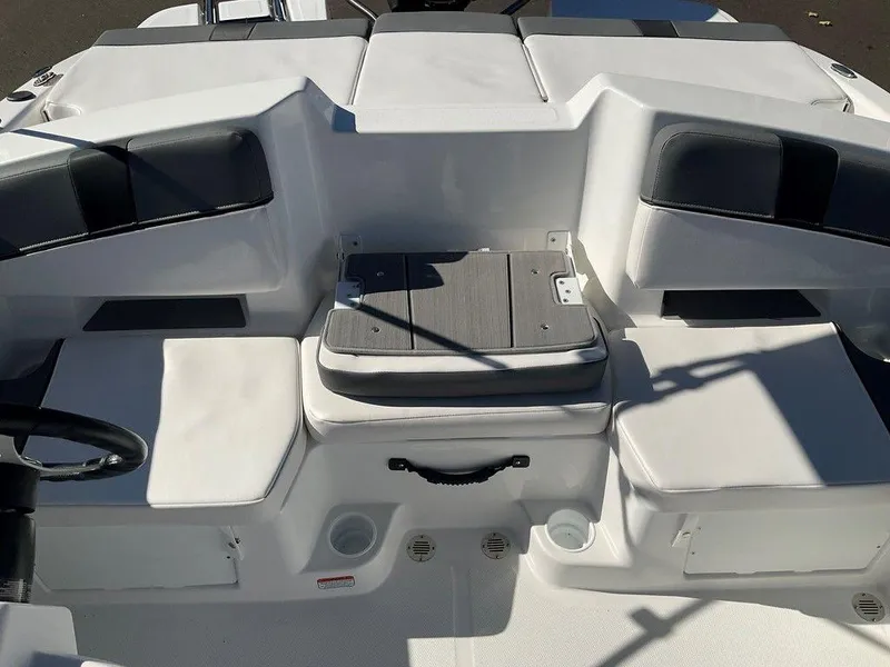 Slide: The Image of 2025 Tahoe T18 boat interior with white seating and storage compartments. - 17