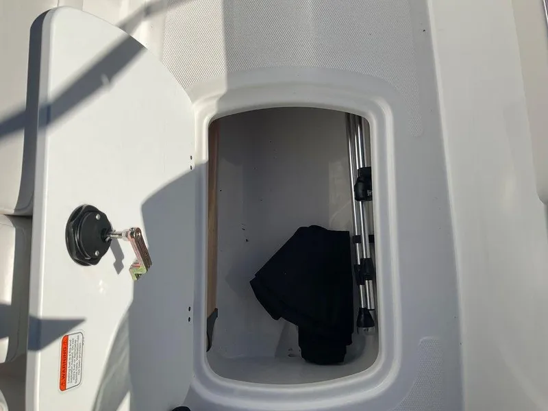 Slide: The Image of Open storage compartment on 2025 Tahoe T18 boat. - 23