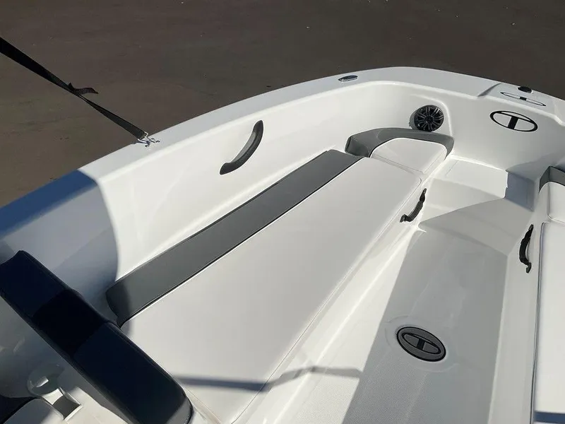 Slide: The Image of 2025 Tahoe T18 boat interior with white seating and storage compartments. - 24