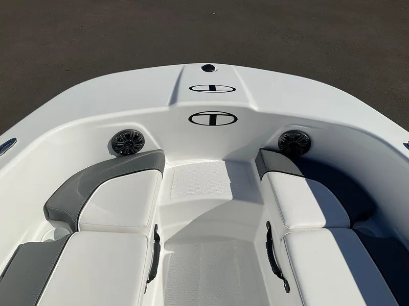 Slide: The Image of 2025 Tahoe T18 boat interior with white seating and built-in speakers. - 29