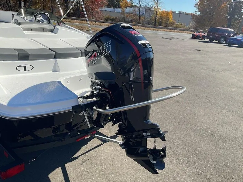 Slide: The Image of 2025 Tahoe T18 boat with powerful outboard motor in a sunny outdoor setting. - 31