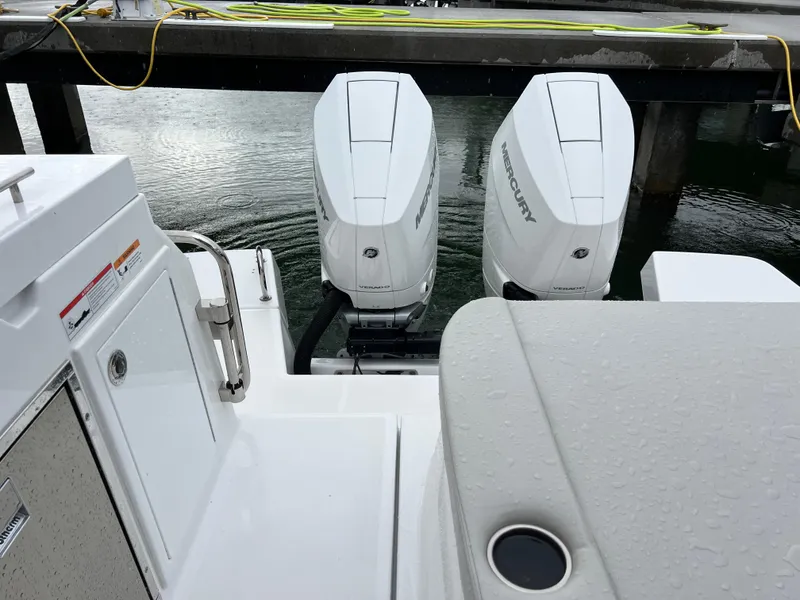 Slide: The Image of 2025 Beneteau Gran Turismo 36 with twin Mercury outboard engines at dock. - 12