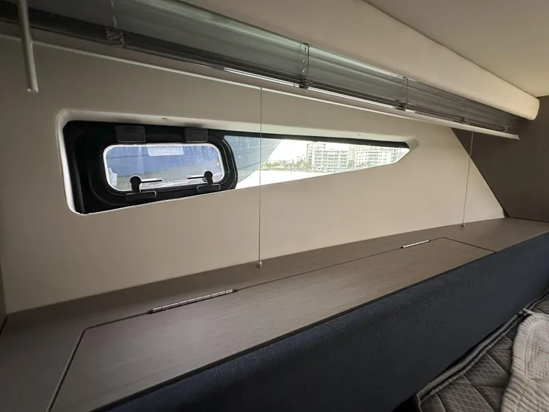 Slide: The Image of Interior view of 2025 Beneteau Gran Turismo 36 yacht window and seating area. - 20