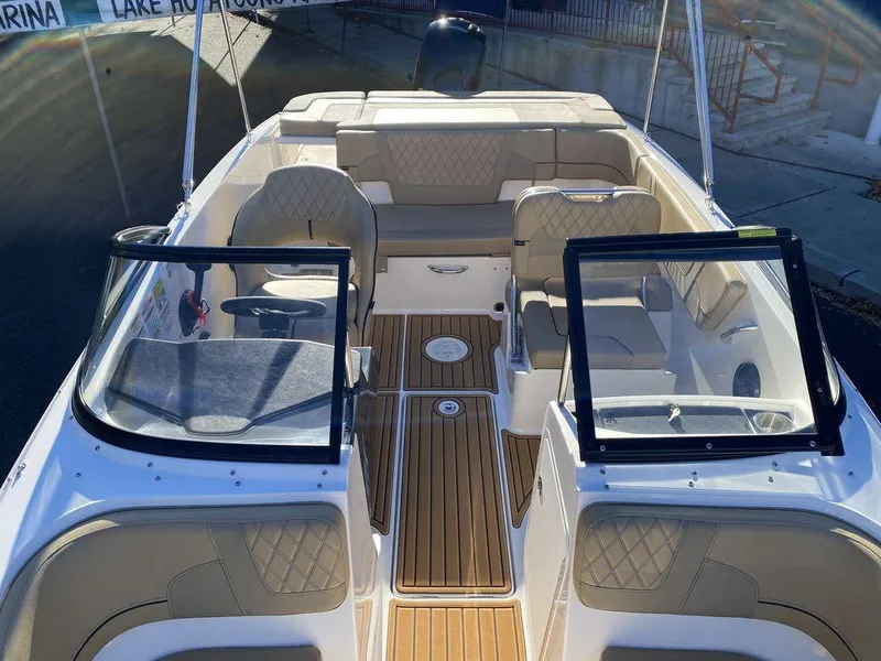 Slide: The Image of 2025 Bayliner VR5 Outboard boat interior with seating and open deck layout. - 11