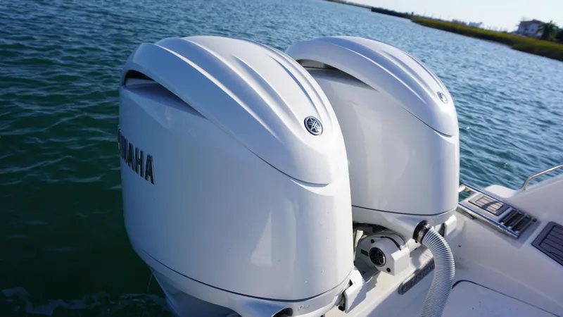 Slide: The Image of Twin Yamaha outboard engines on 2024 Tidewater 256 CC Adventure boat. - 12