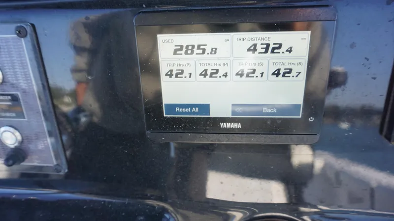 Slide: The Image of Yamaha display on 2024 Tidewater 256 CC Adventure showing fuel usage and trip distance. - 15
