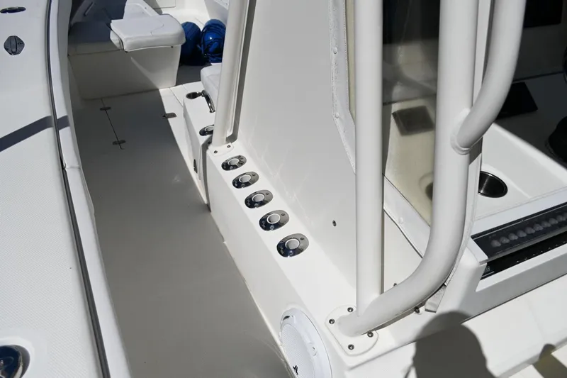 Slide: The Image of 2016 SeaVee 340Z boat interior with rod holders and seating area. - 14