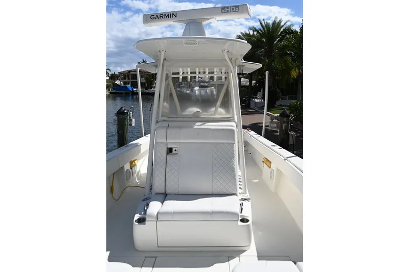 Slide: The Image of 2016 SeaVee 340Z boat with Garmin radar, docked by a scenic waterfront. - 18