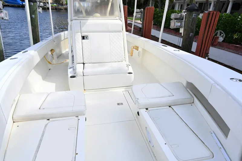Slide: The Image of 2016 SeaVee 340Z boat interior with white seating and storage compartments. - 20