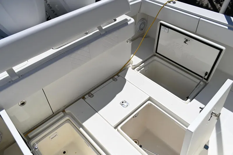 Slide: The Image of 2016 SeaVee 340Z boat with open storage compartments on deck. - 9