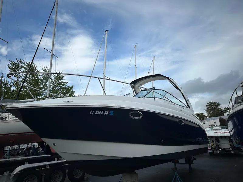 The Image of 2007 Chaparral Signature 270 boat on trailer, under cloudy sky. - 0