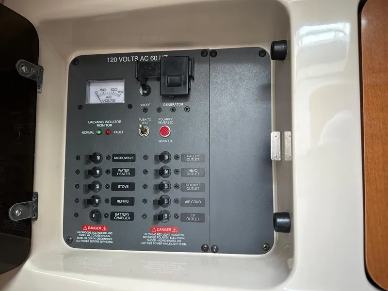 Slide: The Image of Electrical panel of a 2007 Chaparral Signature 270 boat, showing 120 volts AC controls. - 10