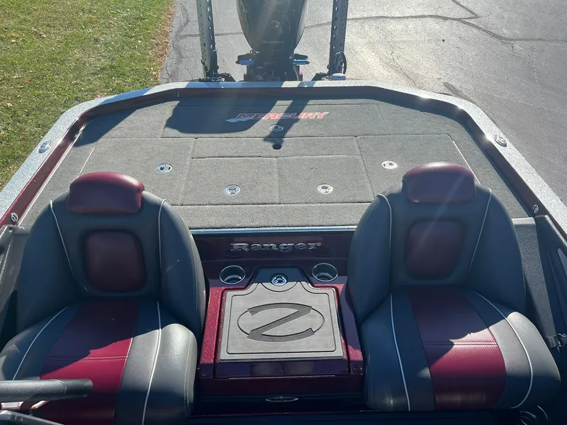 Slide: The Image of 2015 Ranger Z521 Comanche boat interior with dual seats and storage compartments. - 10