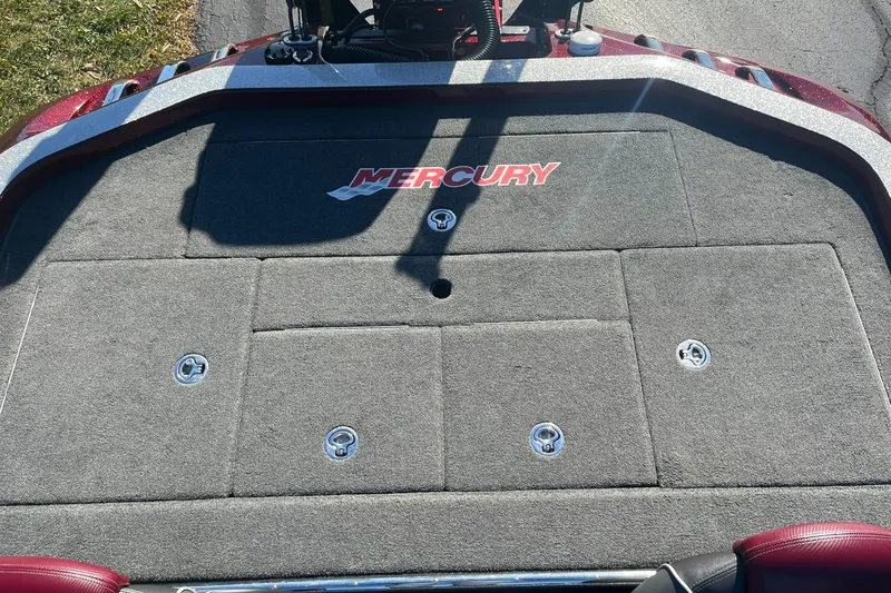 Slide: The Image of 2015 Ranger Z521 Comanche boat deck with Mercury branding, featuring storage compartments. - 11