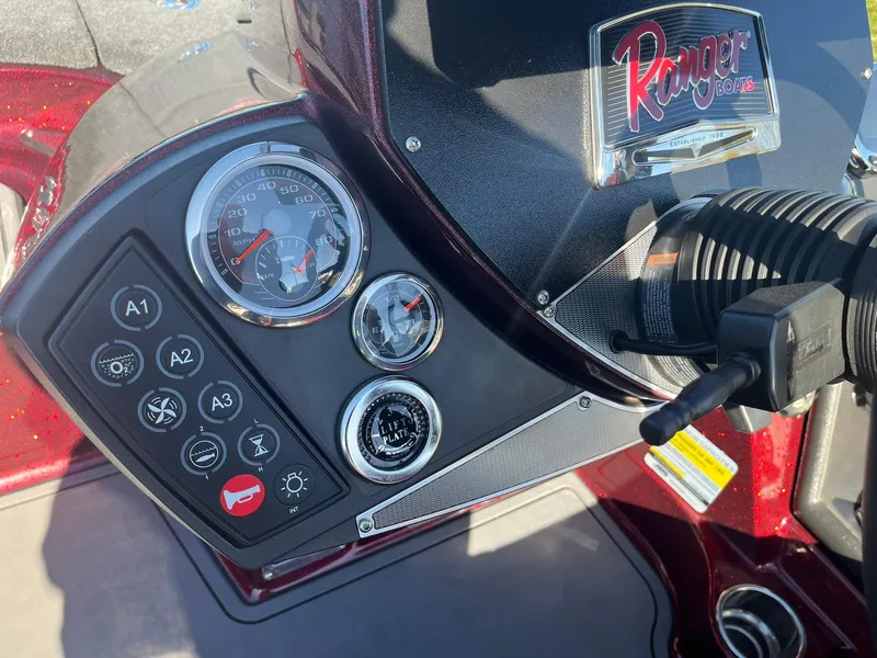 Slide: The Image of 2015 Ranger Z521 Comanche dashboard with gauges and controls. - 13