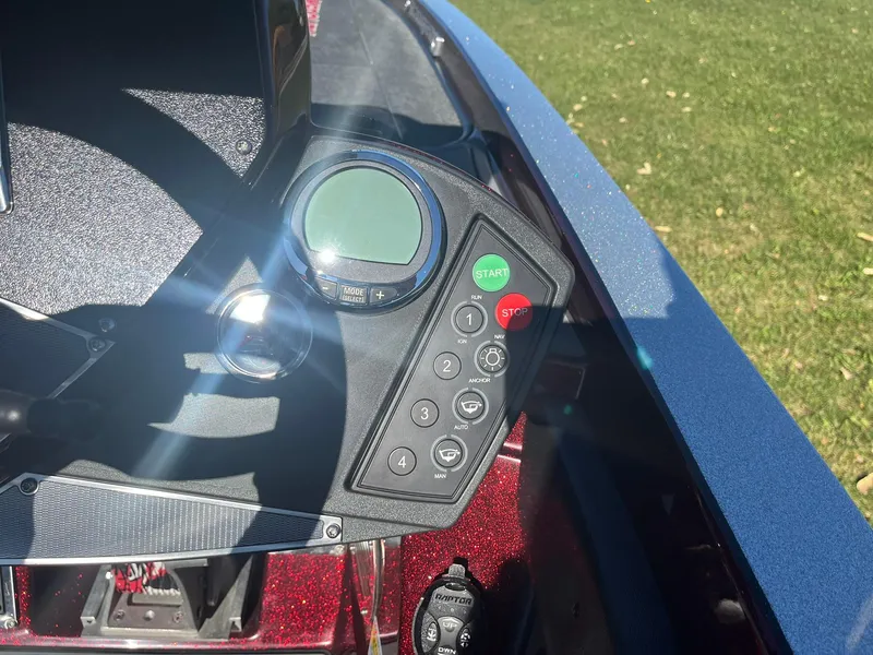 Slide: The Image of Control panel of 2015 Ranger Z521 Comanche boat with buttons and display. - 14